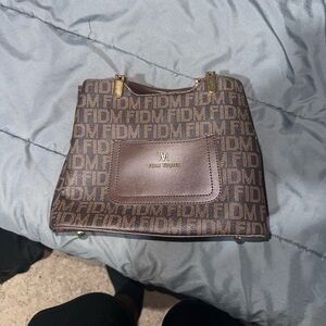 FIDM YIOBE! Purse with a little tear.